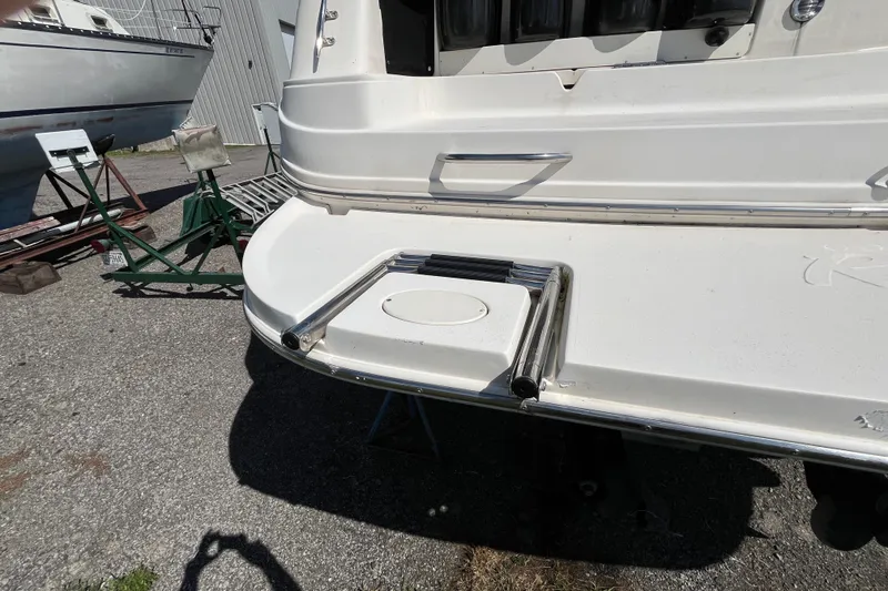 Slide: The Image of Rear view of a 2000 Rinker 340 Fiesta Vee boat on a trailer. - 7