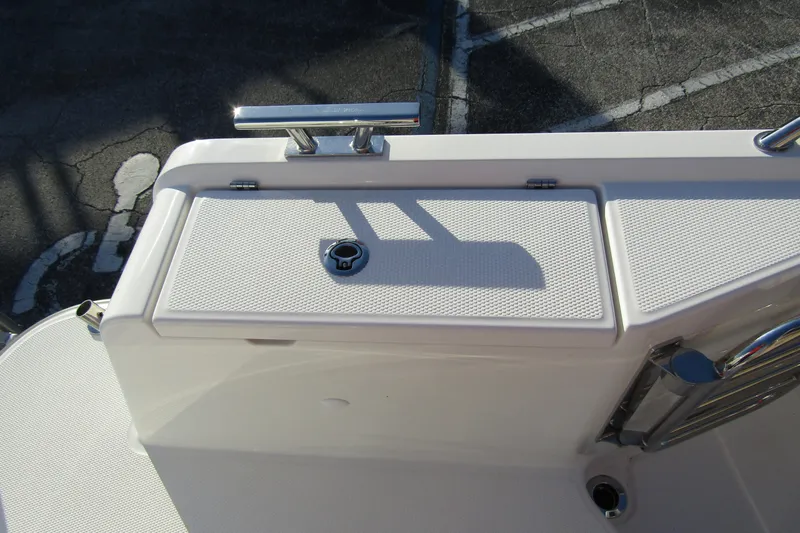 Slide: The Image of 2025 Nimbus Tender 9 boat deck with storage compartment and railing. - 35