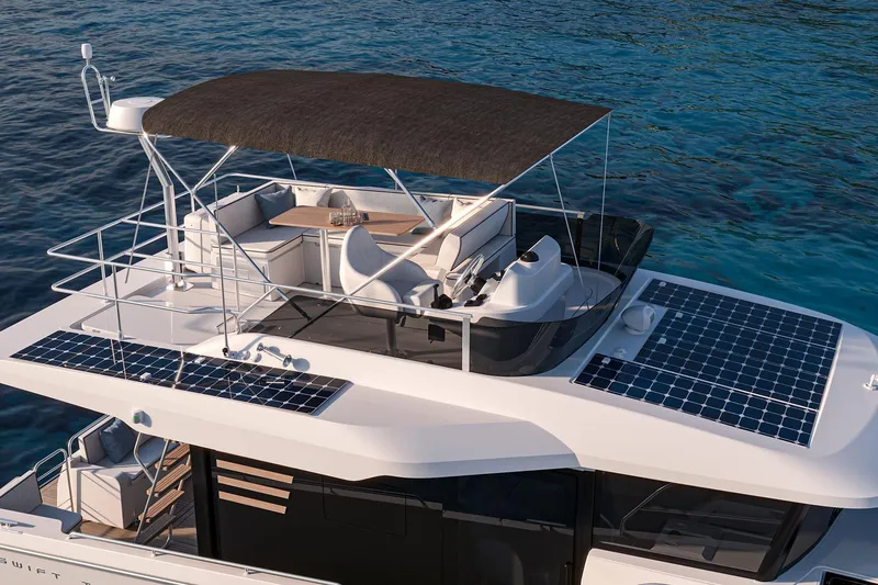 Slide: The Image of 2026 Beneteau Swift Trawler 37 FLY with solar panels on a serene ocean backdrop. - 5