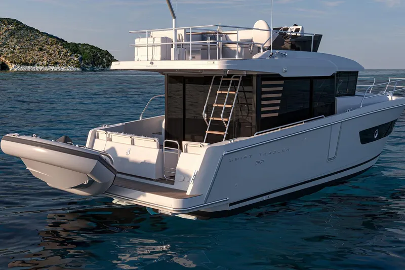 Slide: The Image of 2026 Beneteau Swift Trawler 37 FLY on serene ocean waters, showcasing modern design. - 7