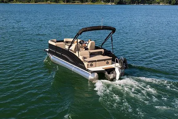 Slide: The Image of Manufacturer Provided Image: 2025 Harris Cruiser 230 pontoon boat cruising on a serene lake. - 8
