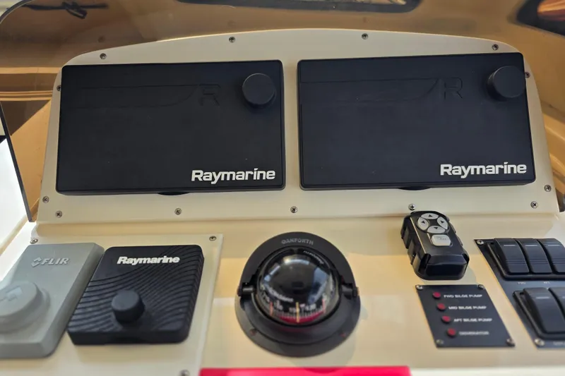 Slide: The Image of Control panel of 2005 Mainship 34 Pilot Sedan Rum Runner II with Raymarine equipment. - 16