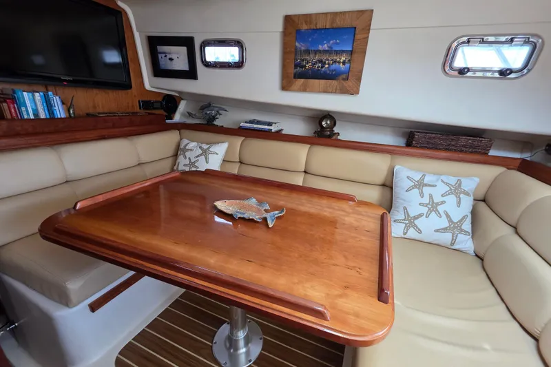 Slide: The Image of Luxurious 2005 Mainship 34 Pilot Sedan Rum Runner II interior with cozy seating and elegant decor. - 26