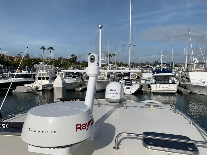 Slide: The Image of 2005 Mainship 34 Pilot Sedan Rum Runner II docked in a marina with navigation equipment. - 4