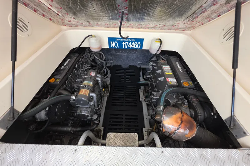 Slide: The Image of Engine compartment of 2005 Mainship 34 Pilot Sedan Rum Runner II with twin Yanmar engines. - 42