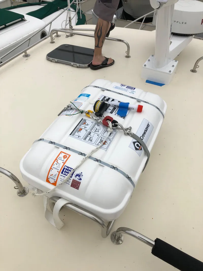 Slide: The Image of Life raft on 2005 Mainship 34 Pilot Sedan Rum Runner II deck. - 48