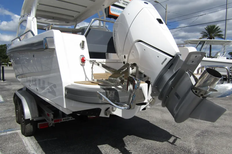 Slide: The Image of Nimbus Weekender 9 boat, 2025 model, on trailer with powerful outboard motor. - 2