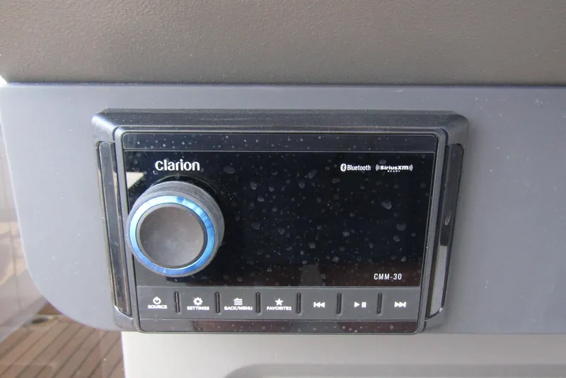 Slide: The Image of Clarion CMM-30 audio system in 2025 Nimbus Weekender 9 boat, featuring Bluetooth and SiriusXM. - 21