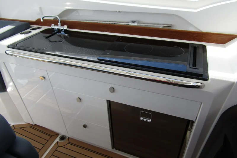 Slide: The Image of Modern kitchenette on 2025 Nimbus Weekender 9 boat with stove and sink. - 33