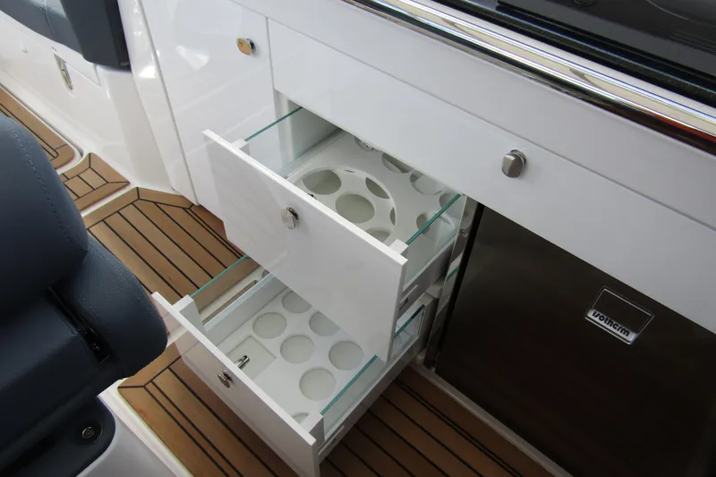 Slide: The Image of Open storage drawers on Nimbus Weekender 9 boat, showcasing modern design and functionality, 2025 model. - 38