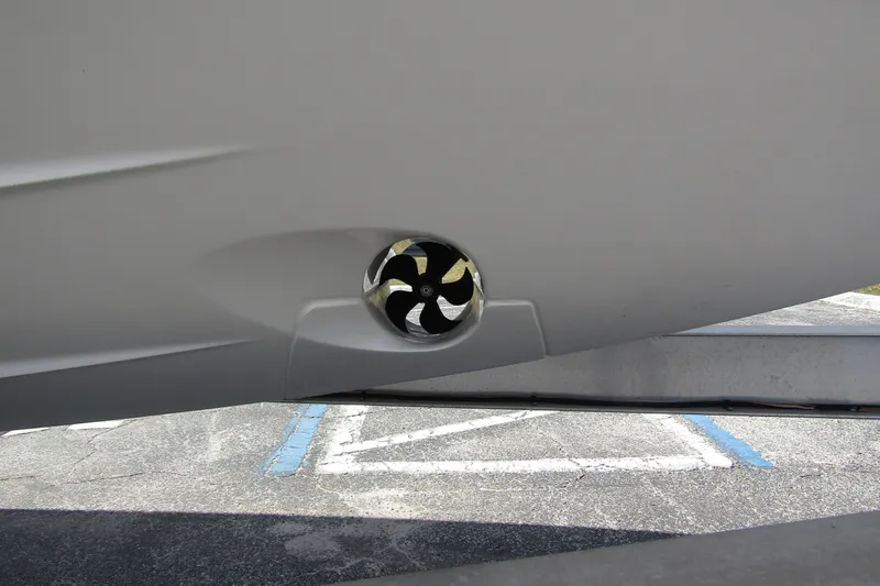 Slide: The Image of Close-up of a 2025 Nimbus Weekender 9 boat's hull with a visible thruster. - 7