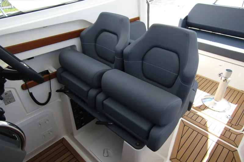 Slide: The Image of Luxury seating in 2025 Nimbus Weekender 9 boat, featuring sleek design and comfortable upholstery. - 15