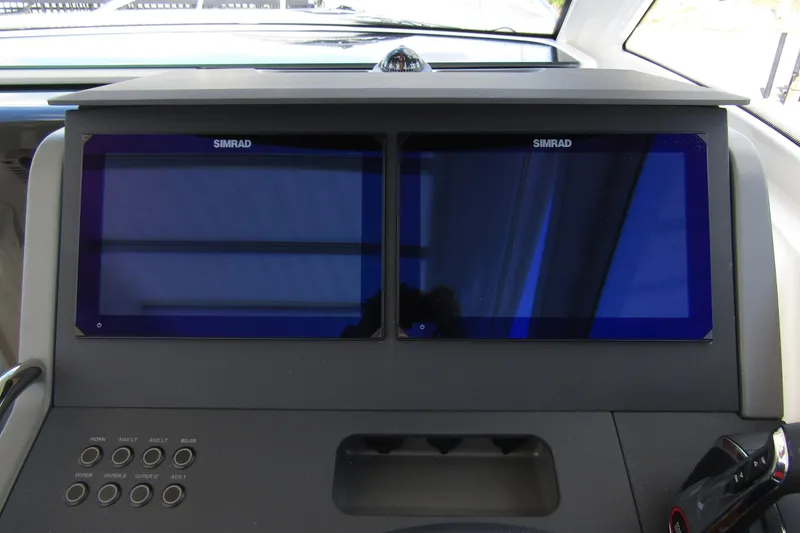 Slide: The Image of Dashboard of 2025 Nimbus Weekender 9 with dual Simrad displays and control panel. - 18