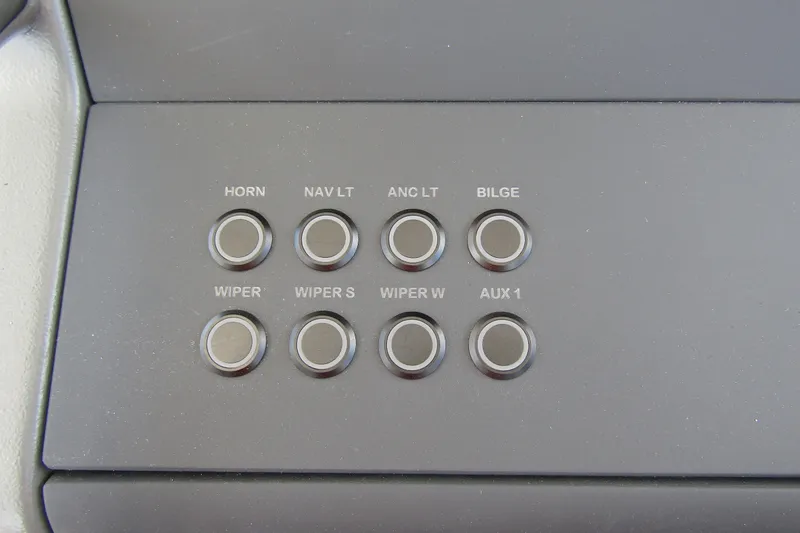 Slide: The Image of Control panel of 2025 Nimbus Weekender 9 boat with labeled buttons for various functions. - 19