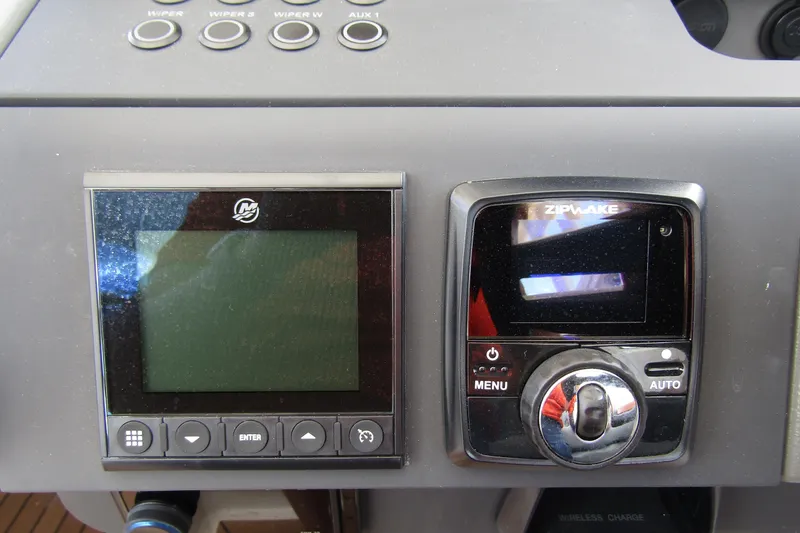 Slide: The Image of Control panel of 2025 Nimbus Weekender 9 boat with digital displays and buttons. - 20