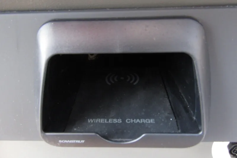 Slide: The Image of Wireless charging compartment in 2025 Nimbus Weekender 9 boat. - 22