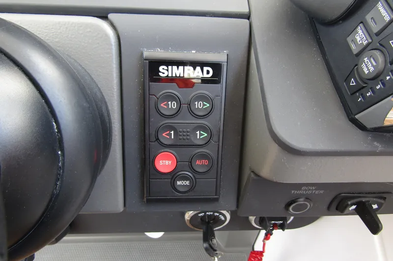 Slide: The Image of Control panel of Nimbus Weekender 9, 2025 model, featuring Simrad navigation system. - 23