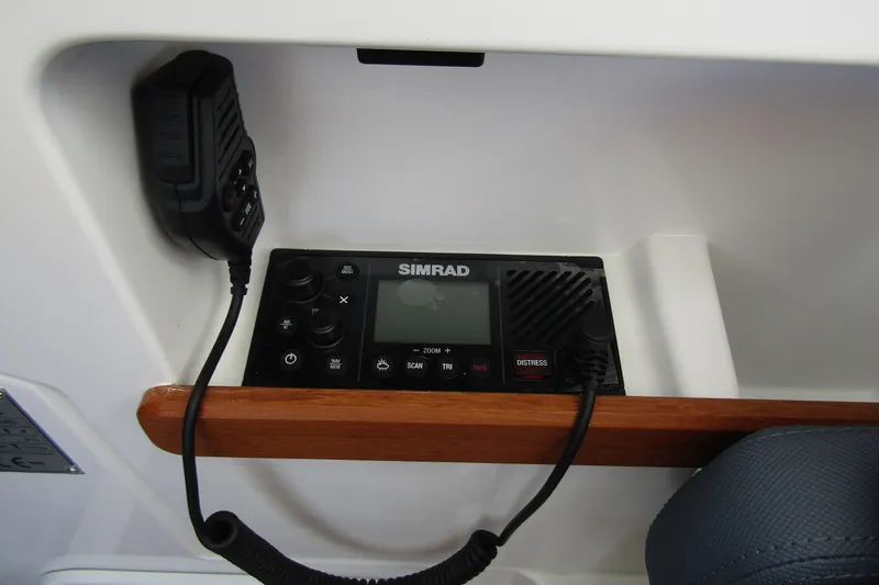 Slide: The Image of Simrad radio system in 2025 Nimbus Weekender 9 boat, featuring a distress button. - 25
