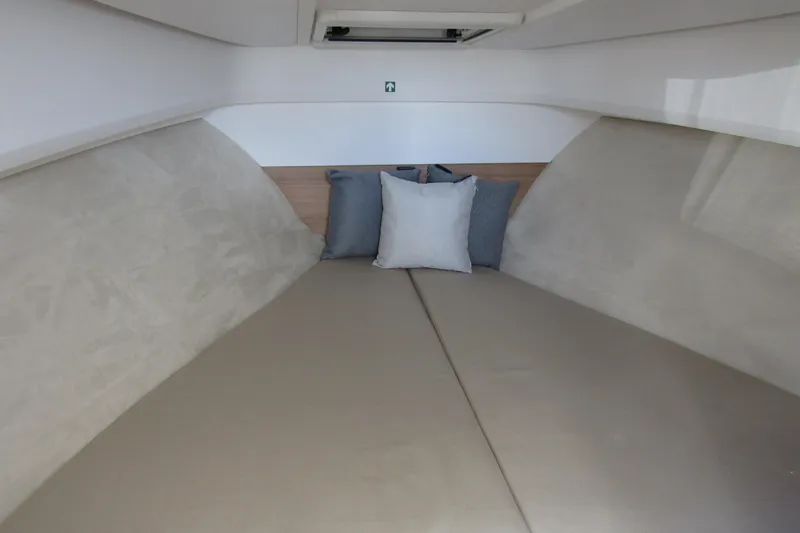Slide: The Image of Interior cabin of 2025 Nimbus Weekender 9 with cozy bedding and cushions. - 27