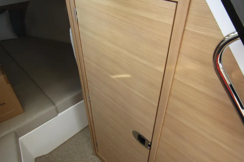 Slide: The Image of Interior cabin view of 2025 Nimbus Weekender 9, featuring wooden door and cozy sleeping area. - 30