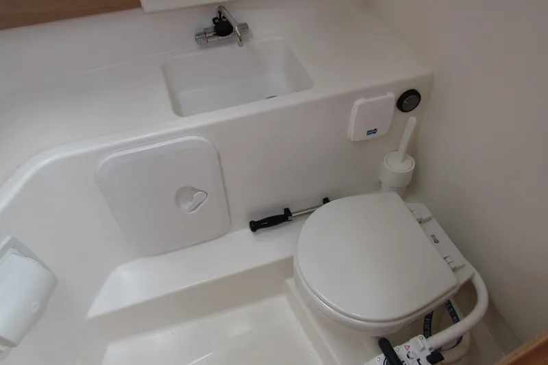 Slide: The Image of Compact bathroom in 2025 Nimbus Weekender 9 boat, featuring toilet and sink. - 31