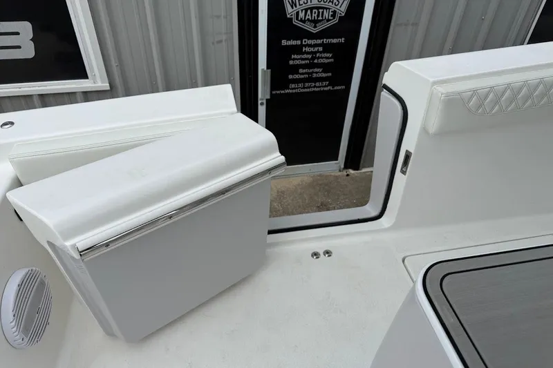 Slide: The Image of 2026 Sea Pro 322 Offshore boat interior with seating and storage compartments. - 12