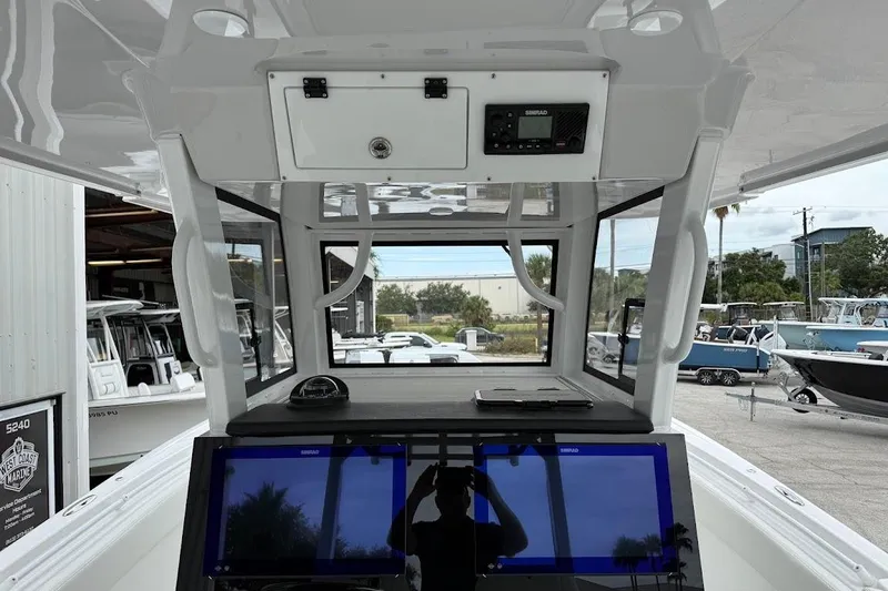 Slide: The Image of Interior view of 2026 Sea Pro 322 Offshore boat with navigation equipment. - 14