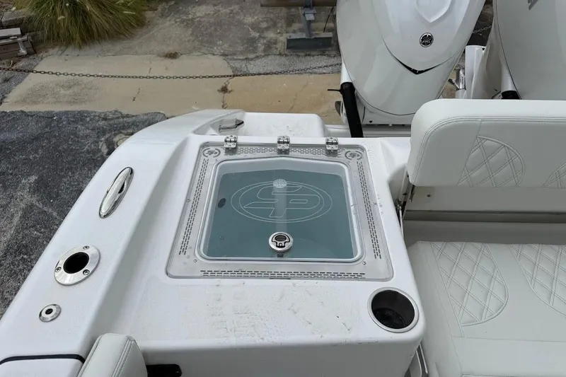 Slide: The Image of 2026 Sea Pro 322 Offshore boat deck with seating and storage compartment. - 16