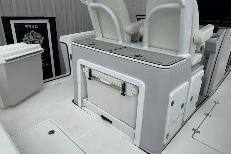 Slide: The Image of 2026 Sea Pro 322 Offshore boat interior with seating and storage compartments. - 18
