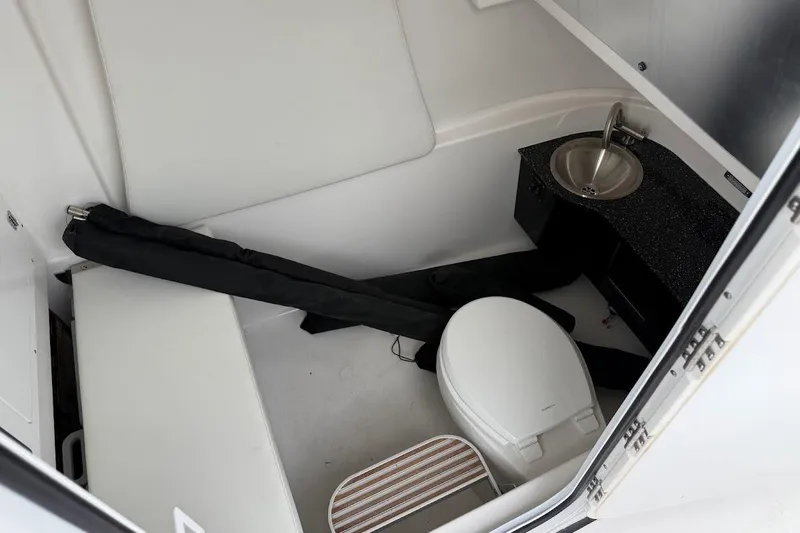 Slide: The Image of 2026 Sea Pro 322 Offshore boat interior with toilet and sink. - 20