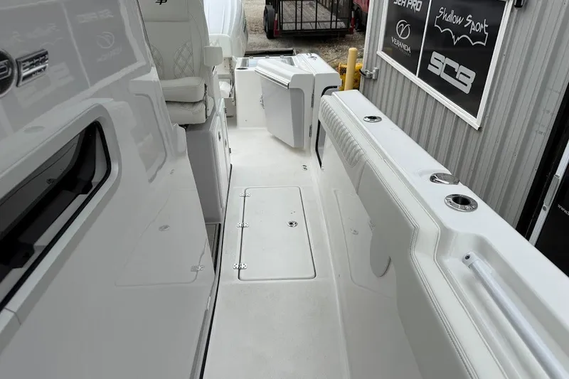 Slide: The Image of 2026 Sea Pro 322 Offshore boat interior, featuring sleek white seating and modern design elements. - 30
