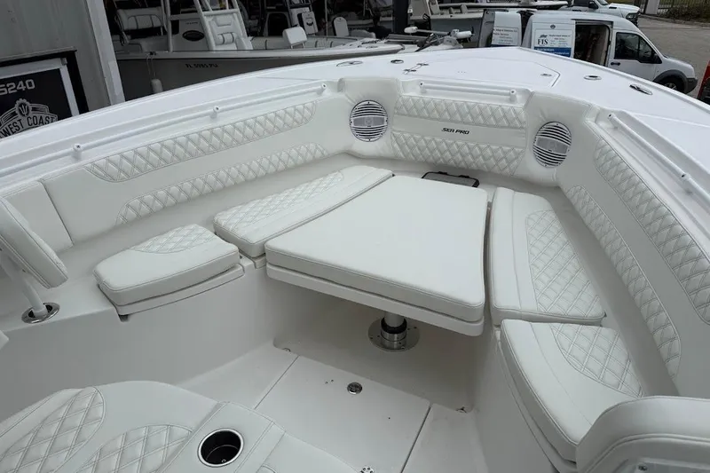 Slide: The Image of Luxurious seating area on 2026 Sea Pro 322 Offshore boat, featuring white quilted upholstery. - 35