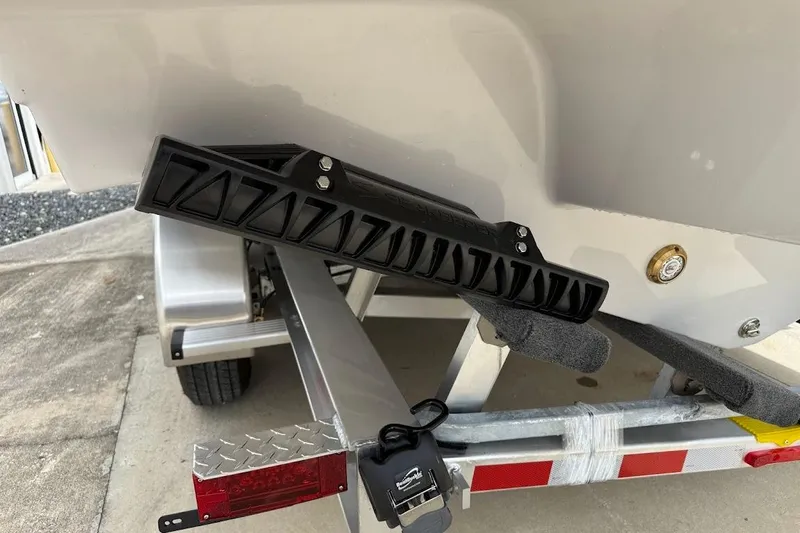 Slide: The Image of 2026 Sea Pro 322 Offshore boat on trailer, featuring a black trim tab. - 9