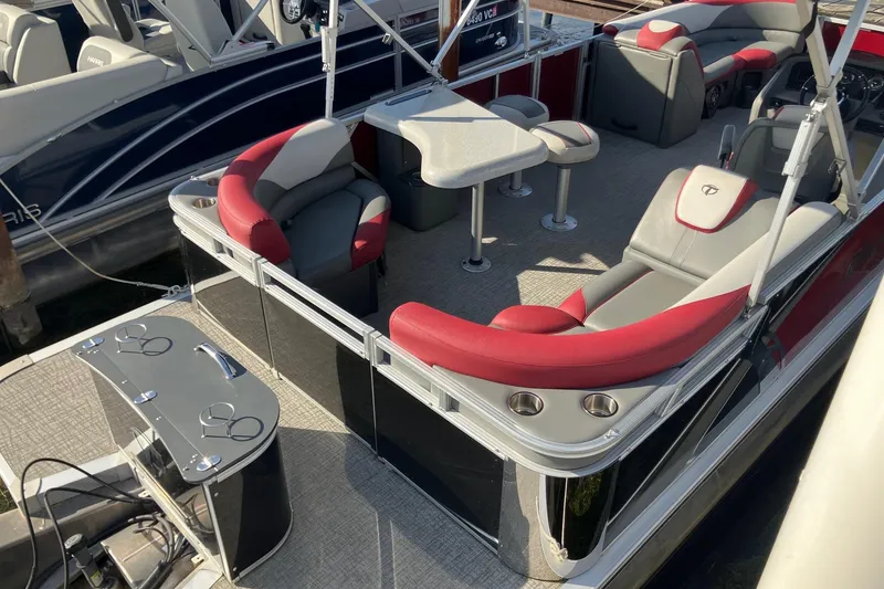Slide: The Image of 2023 Tahoe Pontoon Cascade Platinum Versatile Rear Bench 23' with luxurious seating and table setup. - 3
