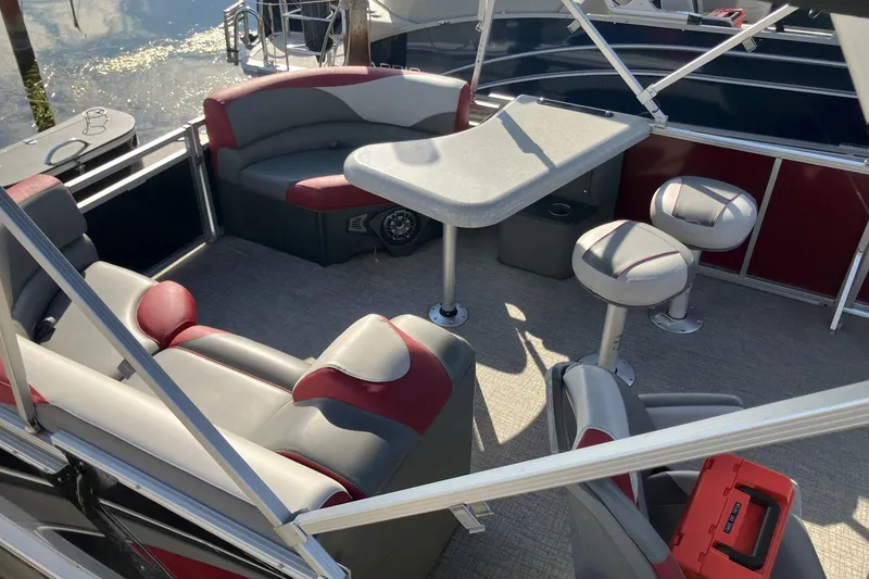 Slide: The Image of 2023 Tahoe Pontoon Cascade Platinum Versatile Rear Bench 23' interior with seating and table. - 5