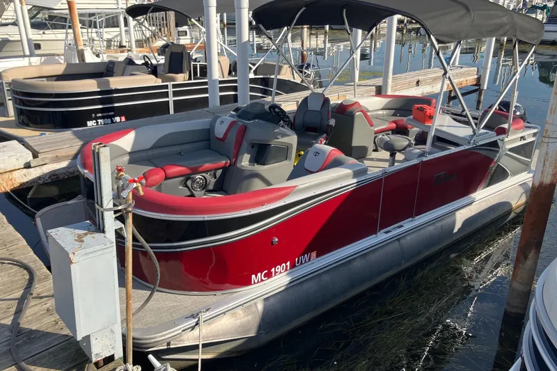 Slide: The Image of 2023 Tahoe Pontoon Cascade Platinum Versatile Rear Bench 23' docked at marina. - 7