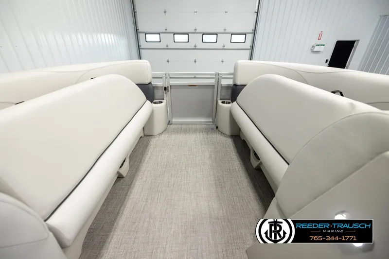 Slide: The Image of Interior of 2026 Avalon VLS QL pontoon boat with beige seating and carpet flooring. - 19