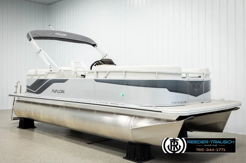 Slide: The Image of 2026 Avalon VLS QL pontoon boat in showroom, featuring sleek design and modern amenities. - 2