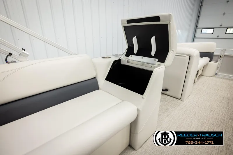 Slide: The Image of Luxurious 2026 Avalon VLS QL boat interior with plush seating and storage compartment. - 25