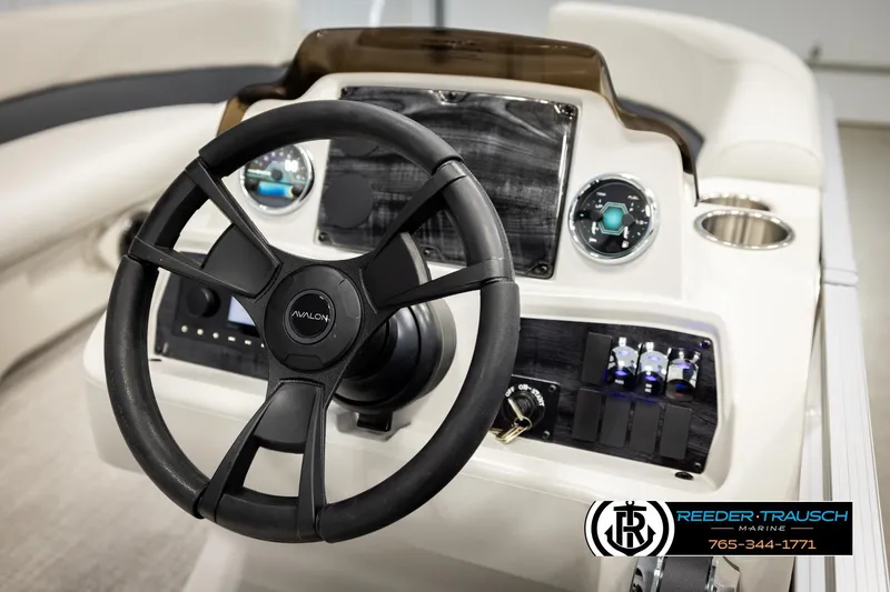 Slide: The Image of 2026 Avalon VLS QL boat dashboard with steering wheel and control panel. - 28