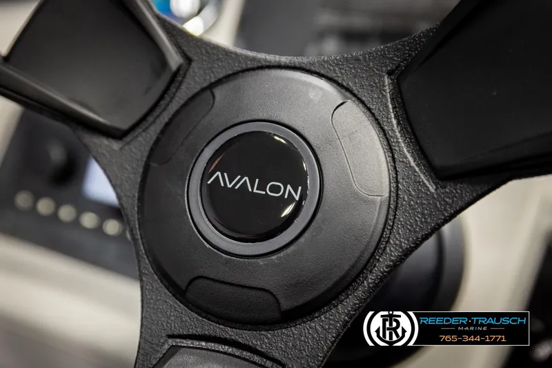 Slide: The Image of Steering wheel of 2026 Avalon VLS QL boat, featuring Reeder-Trausch Marine logo. - 30