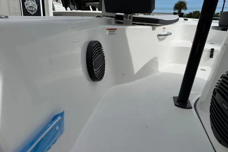 Slide: The Image of Interior view of 2026 Sea Pro 230 Bay boat, featuring speakers and seating area. - 20
