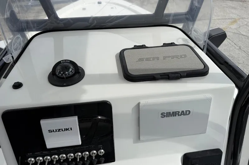 Slide: The Image of Dashboard of 2026 Sea Pro 230 Bay boat with Simrad and Suzuki controls. - 22