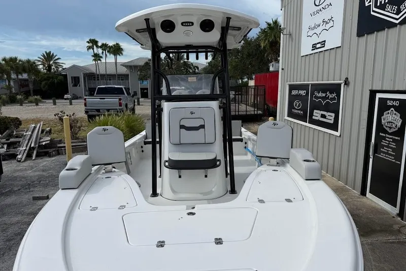 Slide: The Image of 2026 Sea Pro 230 Bay boat at a marina, showcasing sleek design and spacious deck. - 5