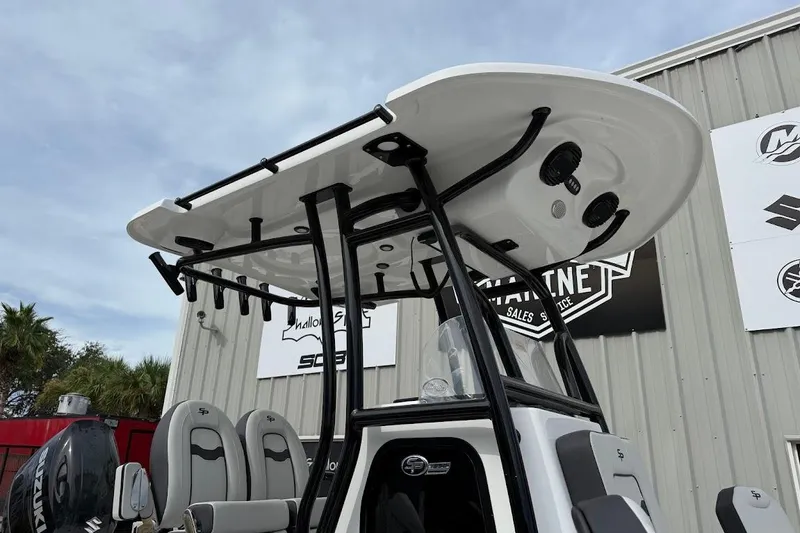 Slide: The Image of 2026 Sea Pro 230 Bay boat with T-top and seating, displayed outdoors. - 9