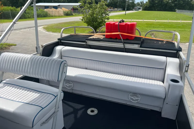 Slide: The Image of 1991 Spectrum 24 Cruise boat interior with white seating and red fuel tank. - 10