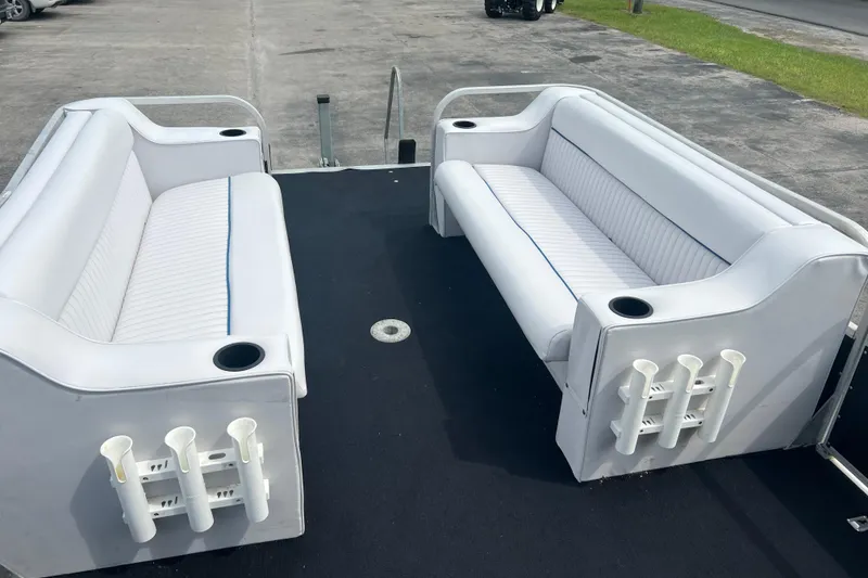 Slide: The Image of 1991 Spectrum 24 Cruise boat interior with white seating and cup holders. - 12