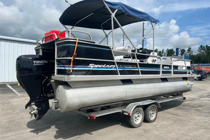 Slide: The Image of 1991 Spectrum 24 Cruise pontoon boat on trailer, featuring Tohatsu outboard motor. - 8