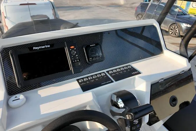 Slide: The Image of Dashboard of 2026 Northstar VEGA 6.4 boat with Raymarine navigation system. - 11