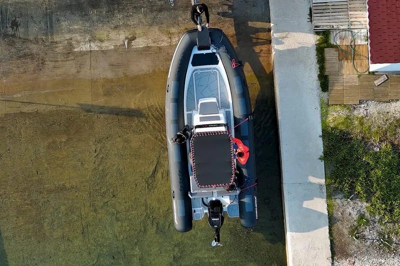 Slide: The Image of Overhead view of 2026 Northstar VEGA 6.4 boat docked by a concrete pier. - 14